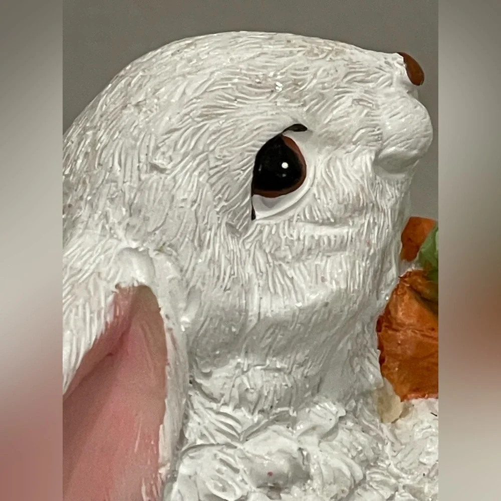 Cute rabbit with carrots statute - rabbit sparkles in light (see video)